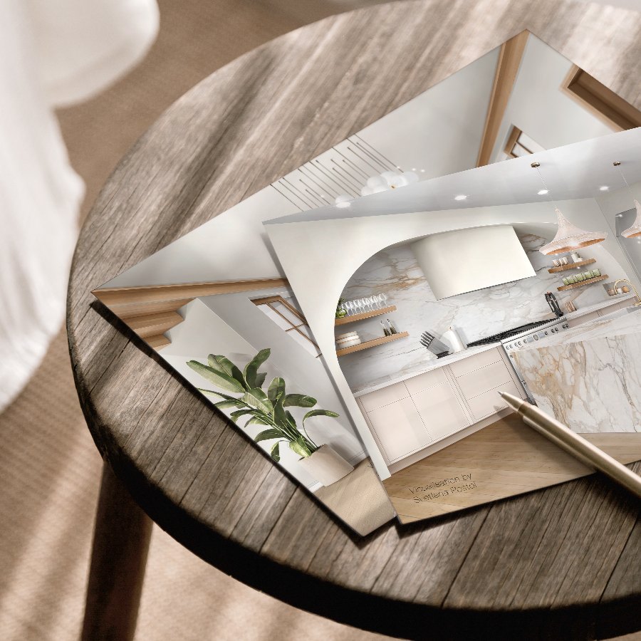 Printed kitchen visualizations on a side table, ready to present
